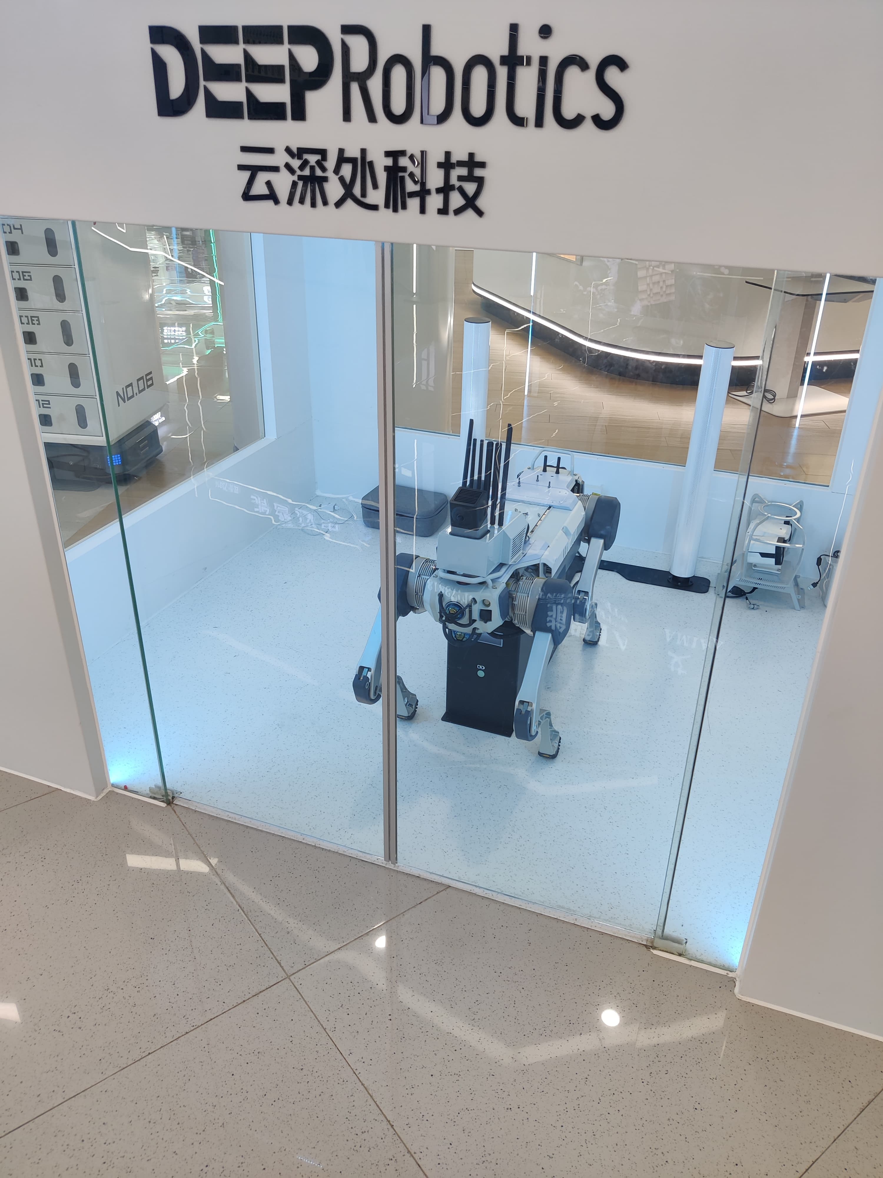 A robotics showroom featuring a quadruped robot